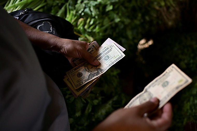 Dollar Scarcity in Venezuela Forces Small Firms to Raise Prices, Turn
to Crypto - US News Money