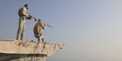 Iran says the Strait of Hormuz is shut down. The Trump administration says 9 million barrels a day are still getting out